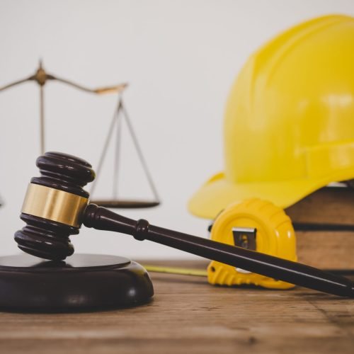 Judge's hammer and helmet Law and Justice about labor law concept Construction law.